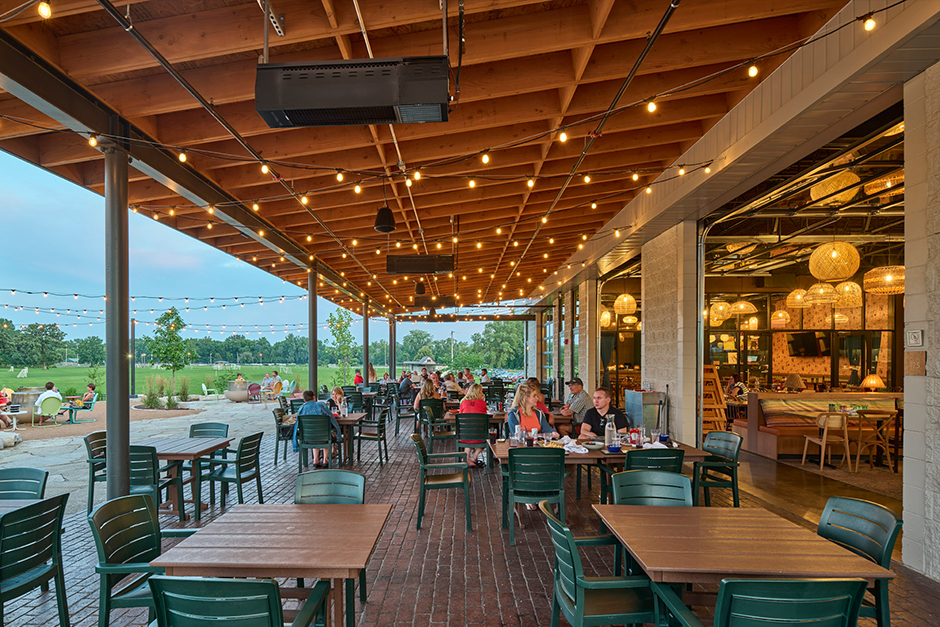 Either Or exterior patio with patrons dining at outdoor tables